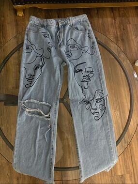 Light Wash Jeans with Black Abstract Face Artwork